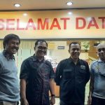 Cramped long-distance bus relay across Java toward Surabaya