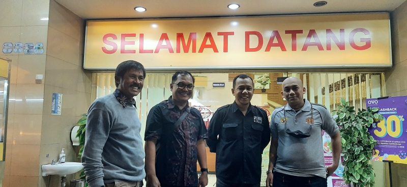 Cramped long-distance bus relay across Java toward Surabaya